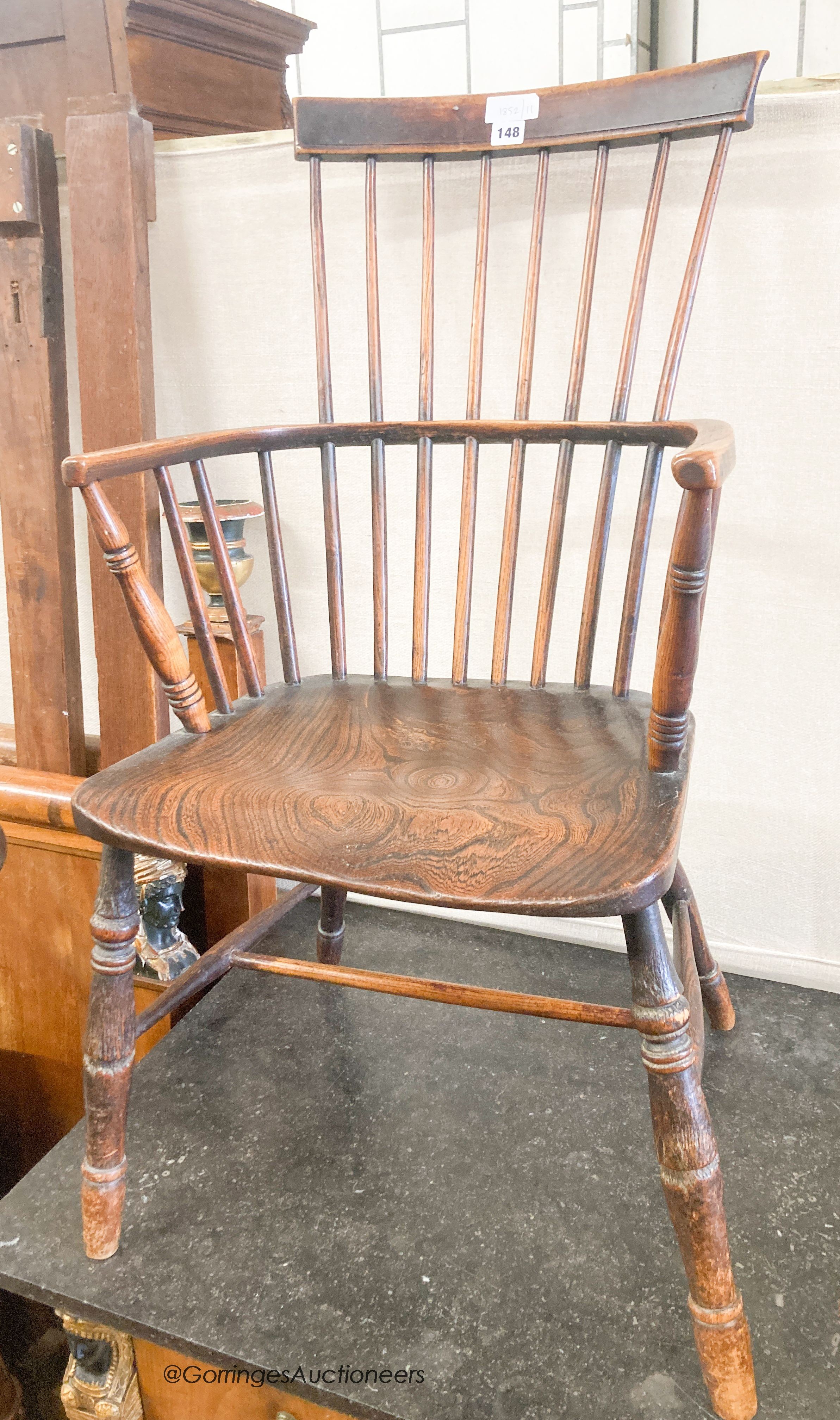 A 19th century elm and fruitwood Windsor comb back armchair, width 50cm, depth 40cm, height 96cm